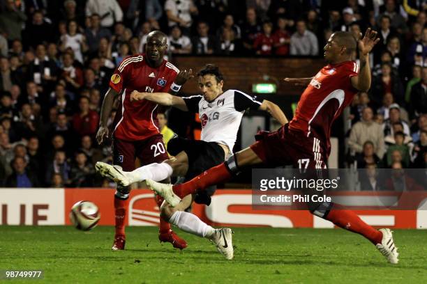 Simon Davies of Fulham shoots and scores his teams first goal during the UEFA Europa League Semi-Final 2nd leg match between Fulham and Hamburger SV...