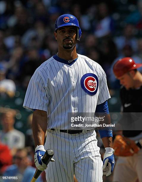 Derrek Lee of the Chicago Cubs walks back to the dugout after striking out against of the Arizona Diamondbacks at Wrigley Field on April 29, 2010 in...