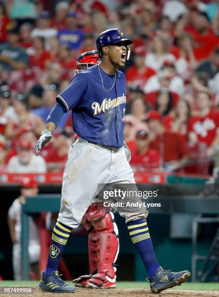 Keon Broxton of the Milwaukee Brewers celebrates after hitting a home run in the ninth inning against the Cincinnati Reds at Great American Ball Park...