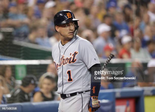 Jose Iglesias of the Detroit Tigers reacts after striking out in the eighth inning during MLB game action against the Toronto Blue Jays at Rogers...