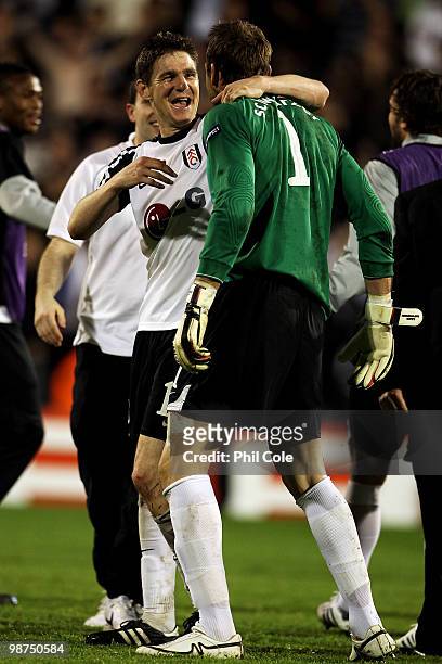Mark Schwarzer and Zoltan Gera of Fulham celebrate victory after the UEFA Europa League Semi-Final 2nd leg match between Fulham and Hamburger SV at...