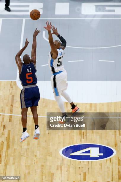 Baron Davis of 3's Company attempts a four point shot past Corey Maggette of Power during week two of the BIG3 three-on-three basketball league at...