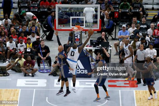 Glen Davis of Power attempts a shot between Drew Gooden and DerMarr Johnson of 3's Company during week two of the BIG3 three-on-three basketball...