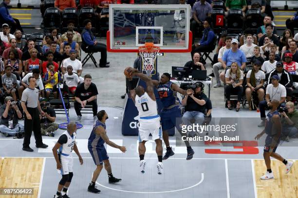 Jason Maxiell of 3's Company fouls Glen Davis of Power during week two of the BIG3 three-on-three basketball league at the United Center on June 29,...
