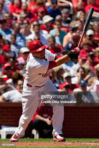 Yadier Molina of the St. Louis Cardinals hits an RBI double against the Atlanta Braves at Busch Stadium on April 29, 2010 in St. Louis, Missouri. The...