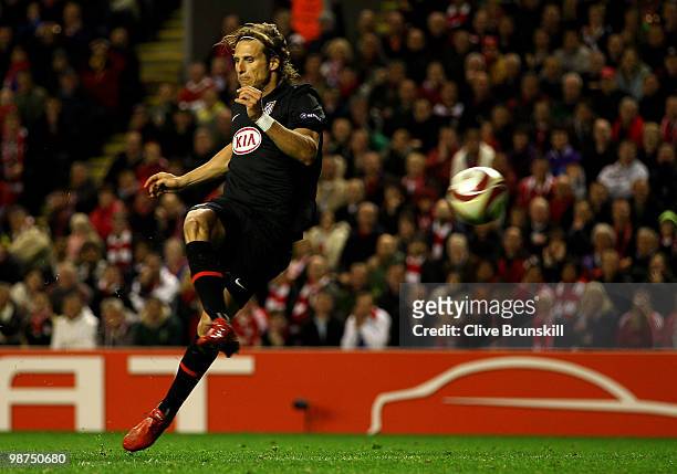 Diego Forlan of Atletico Madrid scores his team's first goal in extra time during the UEFA Europa League Semi-Final Second Leg match between...