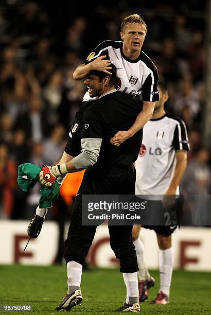 Pascal Zuberbuhler and Damien Duff of Fulham celebrate victory after the UEFA Europa League Semi-Final 2nd leg match between Fulham and Hamburger SV...