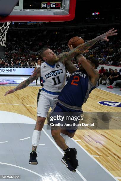 Chris Andersen of Power blocks Andre Emmett of 3's Company during week two of the BIG3 three on three basketball league at United Center on June 29,...