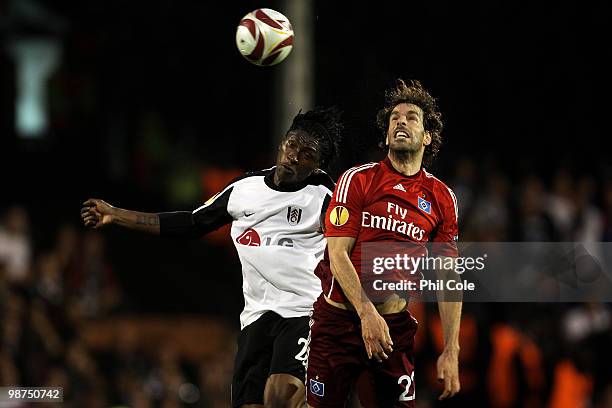 Dickson Etuhu of Fulham battles for the header with Ruud van Nistelrooy of Hamburg during the UEFA Europa League Semi-Final 2nd leg match between...