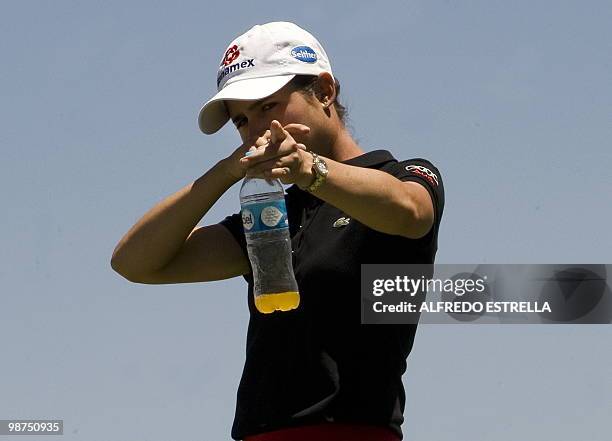 Mexican golfer Lorena Ochoa gestures before her shot at the 7th hole during the first round of the Tres Marias Championship Open of the LPGA Tour at...