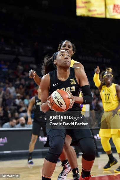 Kelsey Bone of the Las Vegas Aces handles the ball against the Los Angeles Sparks on June 29, 2018 at the Mandalay Bay Events Center in Las Vegas,...