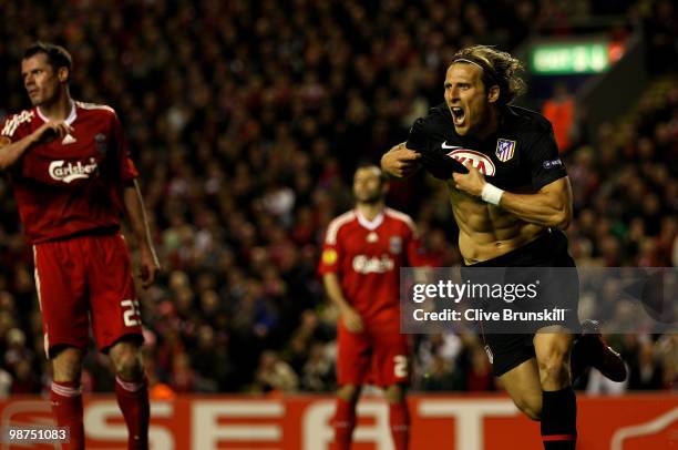 Diego Forlan of Atletico Madrid celebrates scoring his team's first goal in extra time during the UEFA Europa League Semi-Final Second Leg match...