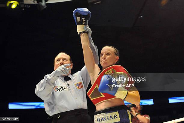 Israeli boxer Hagar Shmoulefeld Finer stands next to the referee after she won the fight against Agnese Boza from Latvia during the Women's...