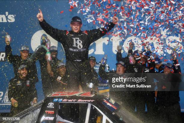 Brett Moffitt, driver of the Fr8Auctions.com Toyota, celebrates in Victory Lane after winning the NASCAR Camping World Truck Series Overton's 225 at...