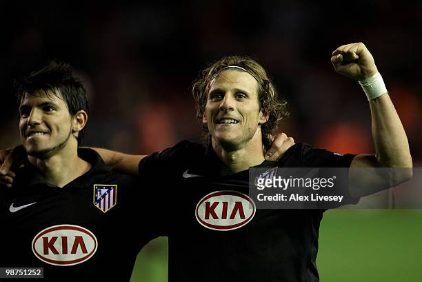 Diego Forlan of Atletico Madrid celebrates with his team mates at the end of the UEFA Europa League Semi-Final Second Leg match between Liverpool and...