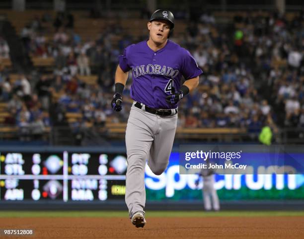 Pat Valaika of the Colorado Rockies rounds second base after hitting a home run against the Los Angeles Dodgers in the fifth inning at Dodger Stadium...