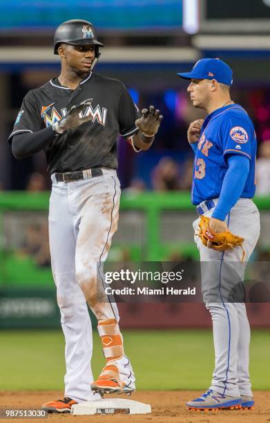 The Miami Marlins' Lewis Brinson doubles in the sixth inning against the New York Mets at Marlins Park in Miami, on Friday, June 29, 2018. The...