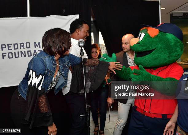 Carolina and Pedro Martinez attend the Pedro Martinez Charity Feast With 45 at Fenway Park on June 29, 2018 in Boston, Massachusetts.