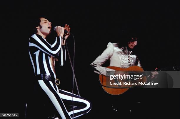Freddie Mercury and Brian May of Queen perform live at The Oakland Coliseum in 1977 in Oakland, California.