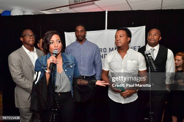 Carolina and Pedro Martinez attend the Pedro Martinez Charity Feast With 45 at Fenway Park on June 29, 2018 in Boston, Massachusetts.