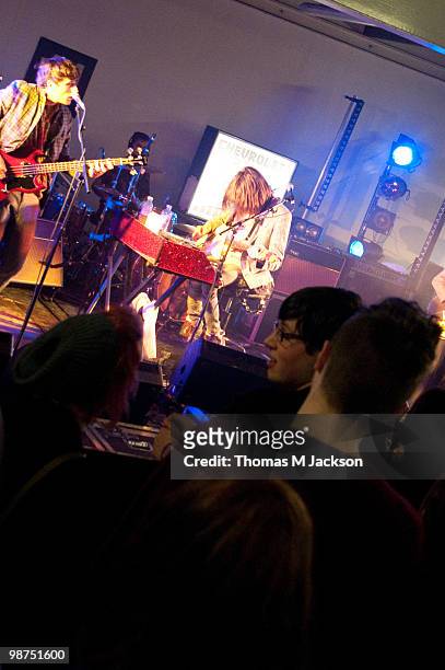 Kai Fish and Blaine Harrison of Mystery Jets perform a secret gig in Dean Street Car Park on April 29, 2010 in Newcastle upon Tyne, England.
