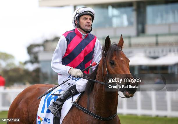 Dwayne Dunn returns to the mounting yard on Zarpoya after winning the Keno Kwikpik Handicap , at Caulfield Racecourse on June 30, 2018 in Caulfield,...