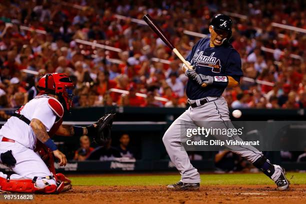 Kurt Suzuki of the Atlanta Braves is hit by a pitch against the St. Louis Cardinals in the eighth inning at Busch Stadium on June 29, 2018 in St....