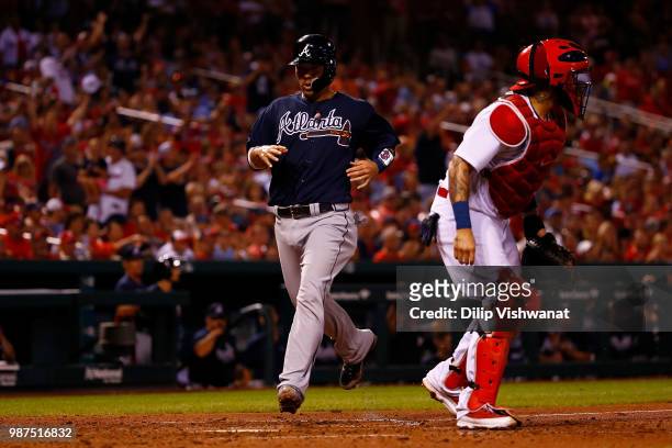 Kurt Suzuki of the Atlanta Braves scores a run against the St. Louis Cardinals in the eighth inning at Busch Stadium on June 29, 2018 in St. Louis,...