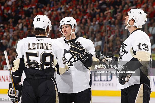 Kris Letang, Sidney Crosby and Bill Guerin of the Pittsburgh Penguins talk during a break in action against the Ottawa Senators in Game 6 of the...