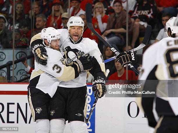 Alex Goligoski and Bill Guerin of the Pittsburgh Penguins celebrate against the Ottawa Senators in Game 6 of the Eastern Conference Quaterfinals...