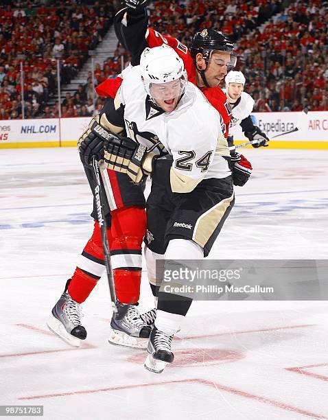 Matt Cooke of the Pittsburgh Penguins is defended by Chris Kelly of the Ottawa Senators in Game 6 of the Eastern Conference Quaterfinals during the...