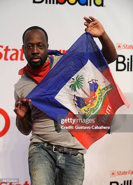 Musician Wyclef Jean holds a Haitian flag at the 2010 Billboard Latin Music Awards at Coliseo de Puerto Rico José Miguel Agrelot on April 29, 2010 in...