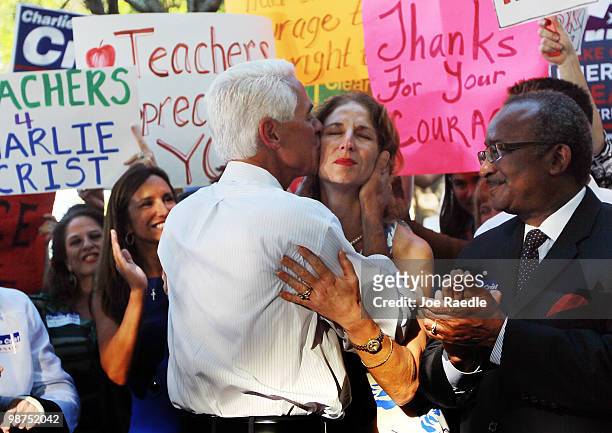 Florida Gov. Charlie Crist kisses his sister Catherine Kennedy during an event where he announced that he will make an independent bid for the open...