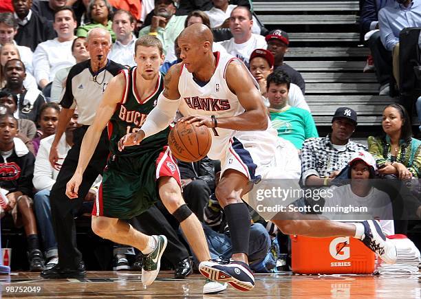 Maurice Evans of the Atlanta Hawks drives against Luke Ridnour of the Milwaukee Bucks in Game Five of the Eastern Conference Quarterfinals during the...