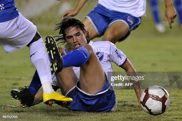 Uruguayan Nacional player Alvaro Gonzalez tries to control the ball during a football match against Brazilian Cruzeiro for the Libertadores Cup in...