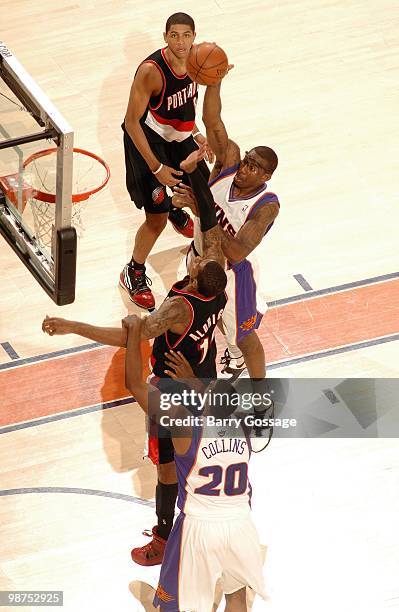 Amar'e Stoudemire of the Phoenix Suns puts up a shot between LaMarcus Aldridge and Patrick Mills of the Portland Trail Blazers in Game Five of the...