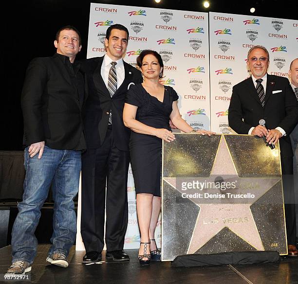 Darin Feinstein poses for photos with Gloria Estefan and Emilio Estefan at the Crown Nightclub at the Rio Hotel & Casino on April 29, 2010 in Las...