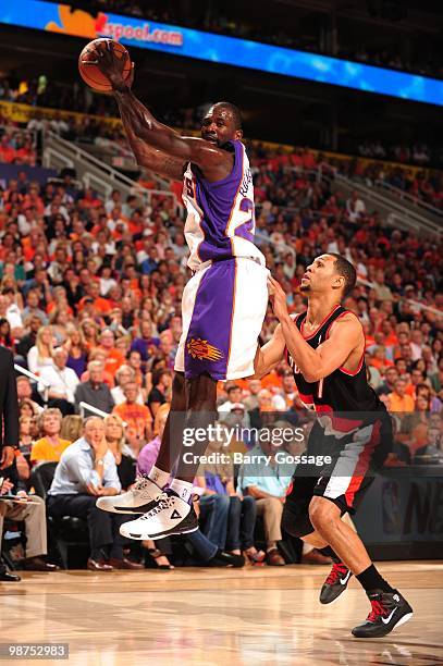 Jason Richardson of the Phoenix Suns pulls in a rebound past Brandon Roy of the Portland Trail Blazers in Game Five of the Western Conference...