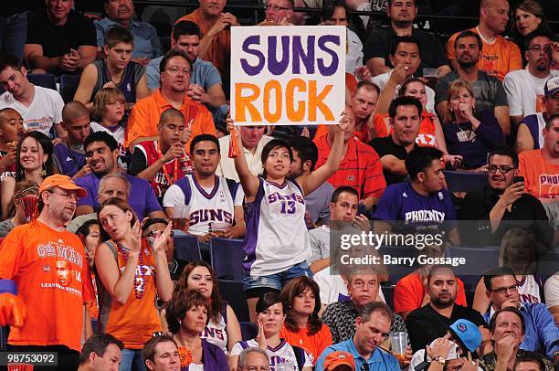 Suns fan holds a poster as the Phoenix Suns take on the Portland Trail Blazers in Game Five of the Western Conference Quarterfinals during the 2010...