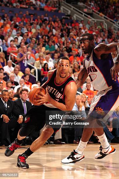 Brandon Roy of the Portland Trail Blazers drives around Amar'e Stoudemire of the Phoenix Suns in Game Five of the Western Conference Quarterfinals...
