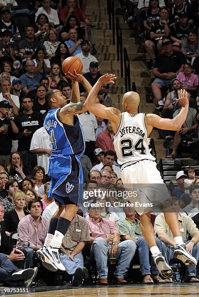 Caron Butler of the Dallas Mavericks shoots the jump shot against Richard Jefferson of the San Antonio Spurs in Game Four of the Western Conference...