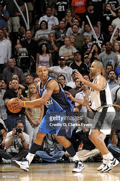 Caron Butler of the Dallas Mavericks looks to make a pass play against Tony Parker of the San Antonio Spurs in Game Four of the Western Conference...