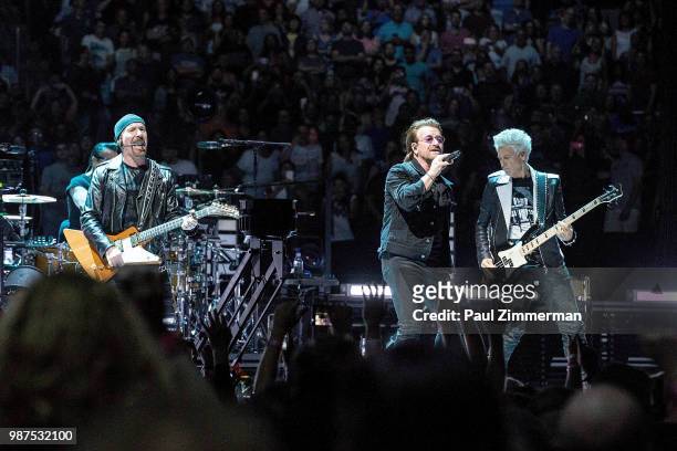 The Edge, Larry Mullen, Jr., Bono, and Adam Clayton of U2 perform onstage during the eXPERIENCE + iNNOCENCE TOUR at Prudential Center on June 29,...