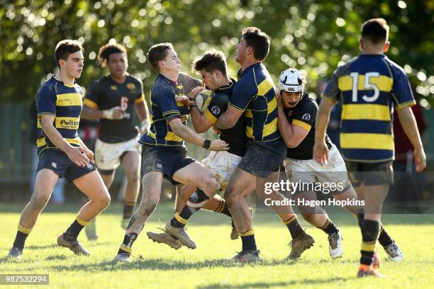 Isaac Wilson of Wellington College is tackled by Sam Smith of Wairarapa College during the schoolboys 2018 Wellington 1st XV Premiership rugby match...