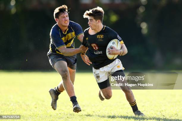 Isaac Wilson of Wellington College is tackled by Sam Smith of Wairarapa College during the schoolboys 2018 Wellington 1st XV Premiership rugby match...