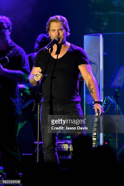 Recording artist and winner of The Voice Season 7 Craig Wayne Boyd performs on stage during the Top 100 Dealer Awards Presented by NAMM at Music City...