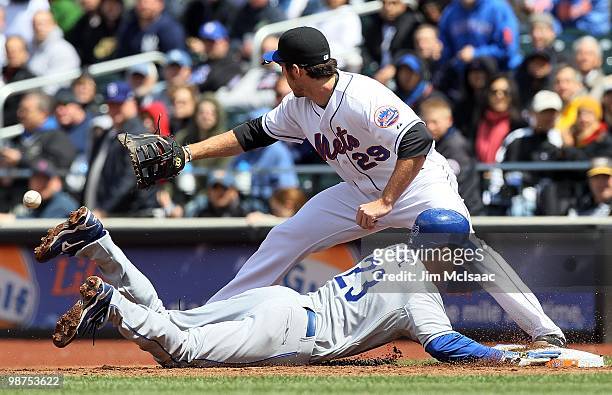 Casey Blake of the Los Angeles Dodgers avoids being picked off as Ike Davis of the New York Mets waits for the throw on April 28, 2010 at Citi Field...