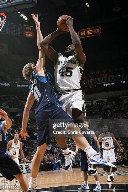 DeJuan Blair of the San Antonio Spurs shoots over Dirk Nowitzki of the Dallas Mavericks in Game Six of the Western Conference Quarterfinals during...