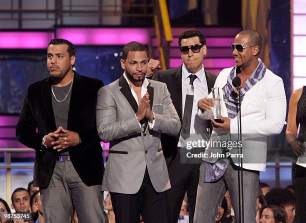 Lenny Santos, Henry Santos Jeter, Max Santos and Anthony 'Romeo' Santos of Aventura accept an award onstage at the 2010 Billboard Latin Music Awards...