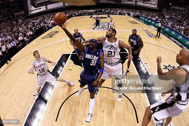 Guard Jason Terry of the Dallas Mavericks takes a shot against Tim Duncan of the San Antonio Spurs in Game Six of the Western Conference...